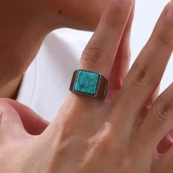 Mat turkiz herrering i stål.