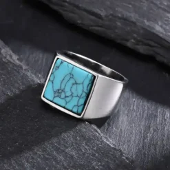 Mat turkiz herrering i stål.